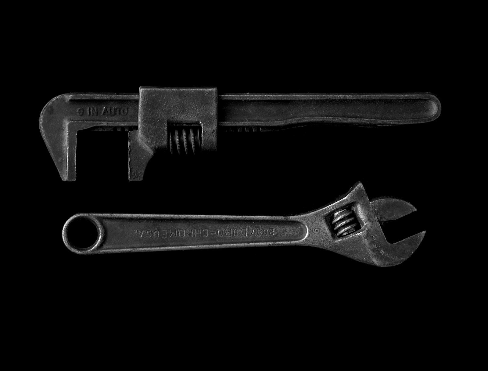 A pipe wrench and plumbing tools