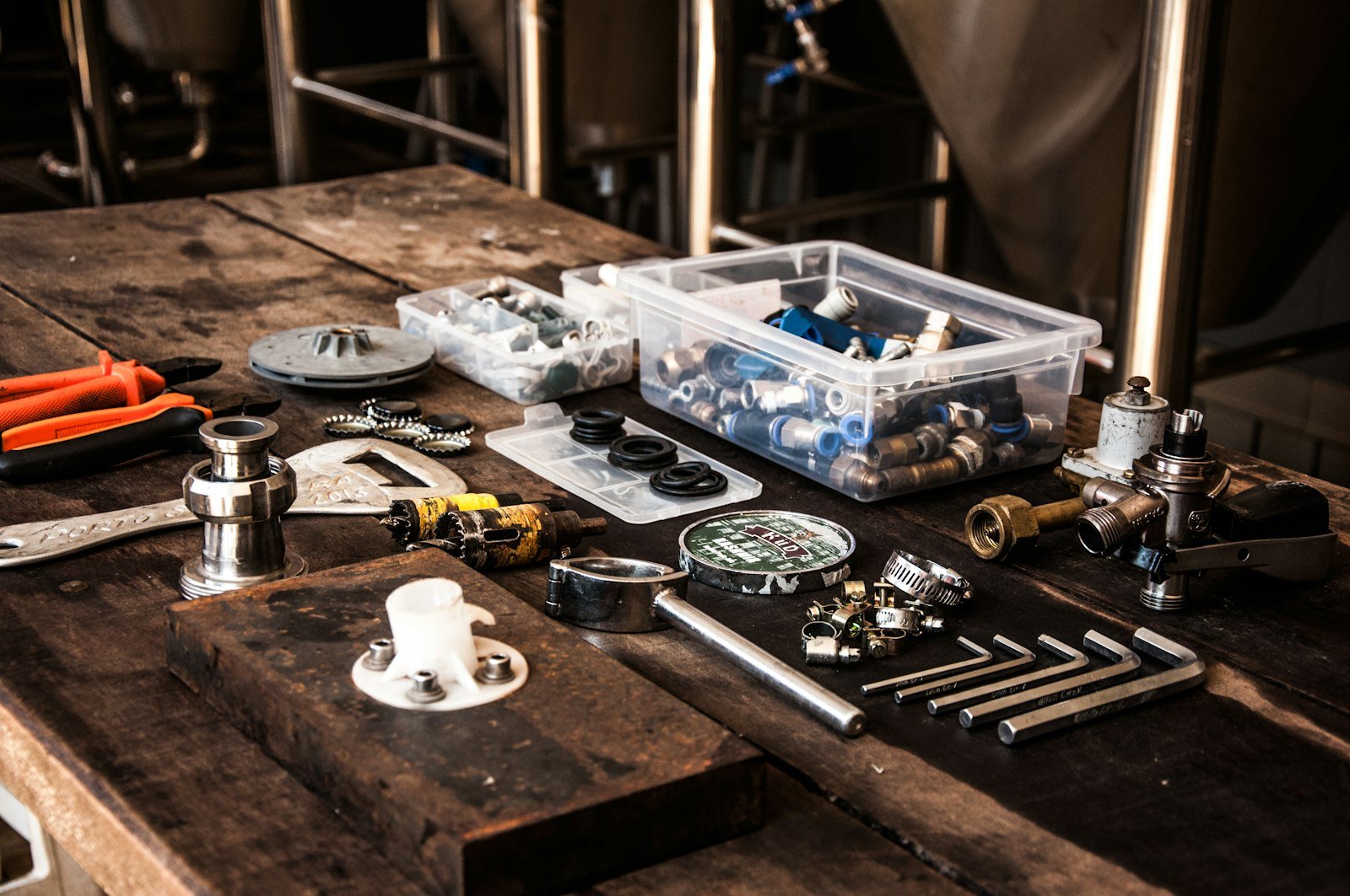 Plumbing tools and fittings on a workbench